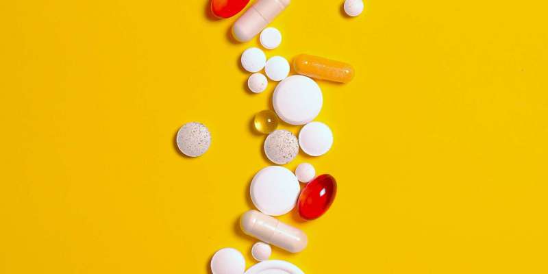 medication-pills-and-capsules-isolated-on-yellow-background-3683102