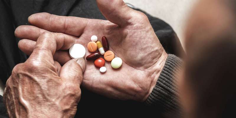 Many,Multi-colored,Pills,In,A,Senior's,Hands.,Painful,Old,Age.